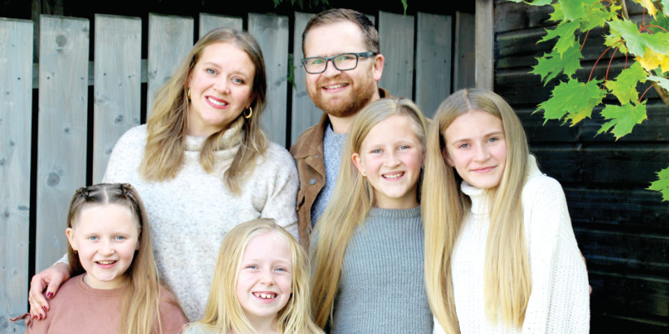 Craig Brotherston and his wife Abby with their four daughters who will head out to Estonia in August.