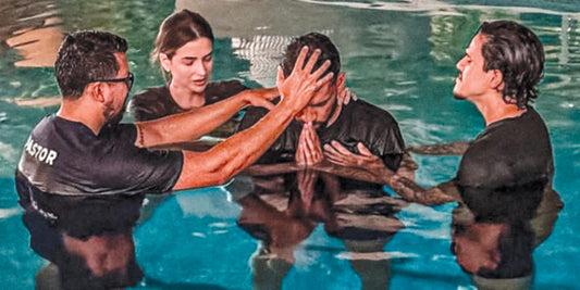 Lucas Paquetá being baptised in the pool at his home