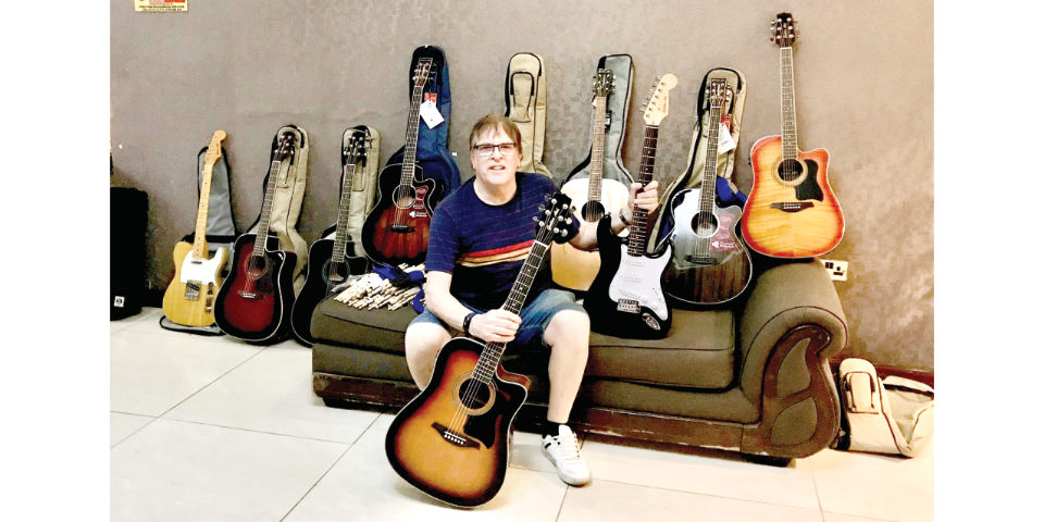 Dave Sumner with some of his guitars