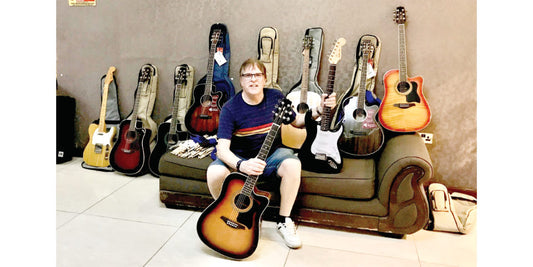 Dave Sumner with some of his guitars