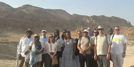 Tour group including, fourth from left, Chris Rolfe